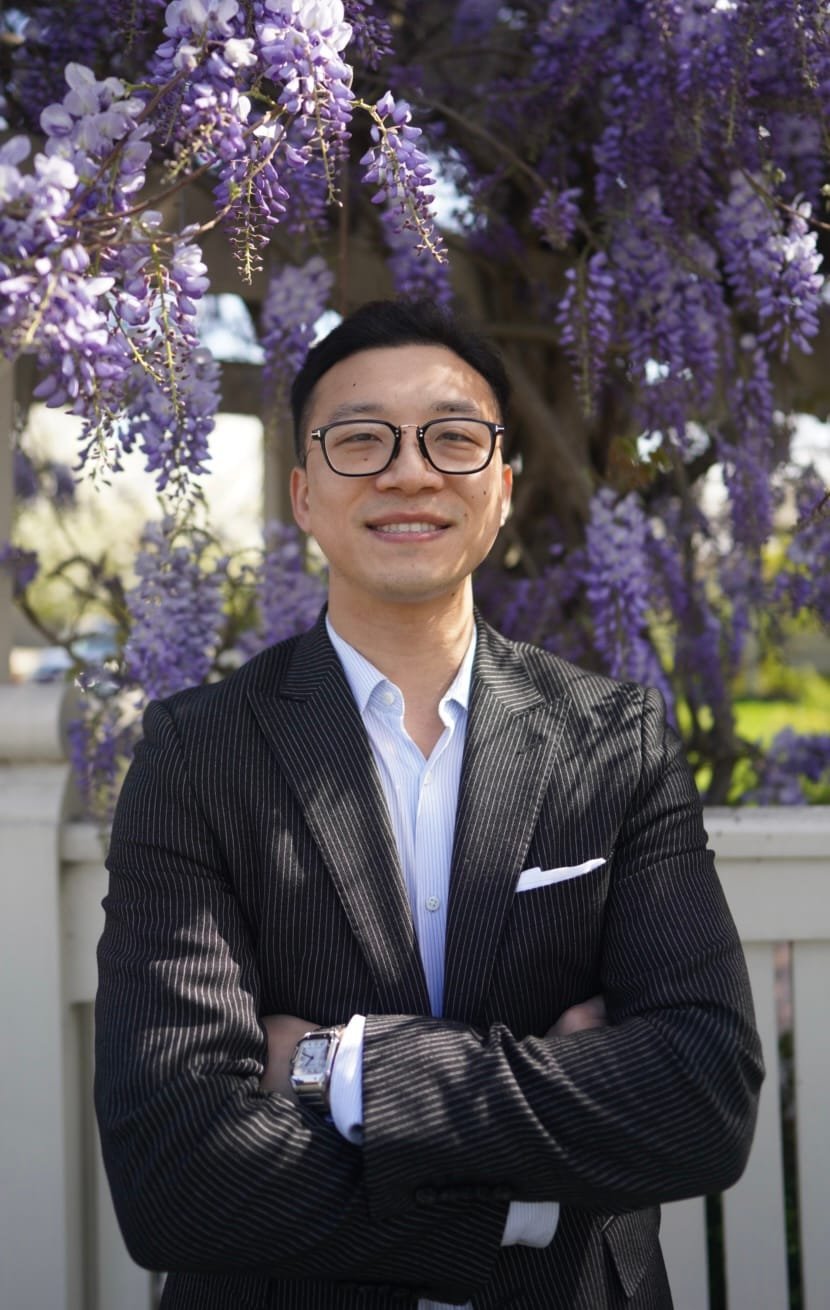 Weicen Yan, qualified audiologist and founder of NeuroHearing, smiling in a professional headshot, providing mobile audiology services in South Eastern Melbourne.